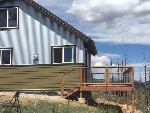 a view of house with roof deck