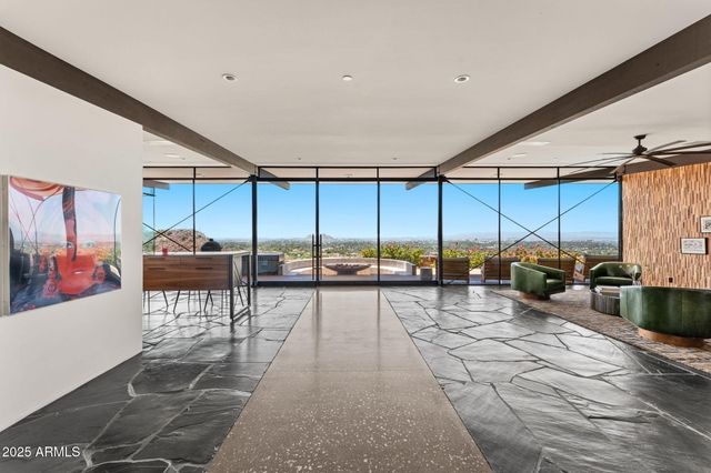 a view of a balcony with wooden floor and outdoor space