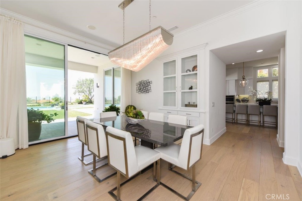 7 Via Brezza Newport Coast, CA 92657 - Photo 14 of 75 a dining room with furniture and a floor to ceiling window