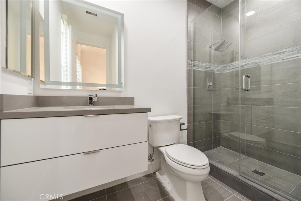 7 Via Brezza Newport Coast, CA 92657 - Photo 37 of 75 a bathroom with a sink a toilet and shower