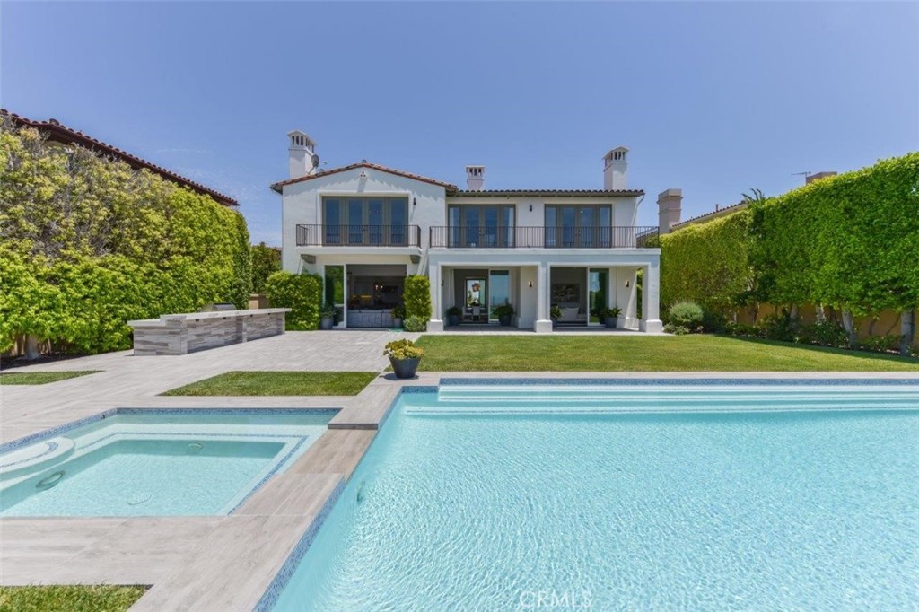 7 Via Brezza Newport Coast, CA 92657 - Photo 61 of 75 a view of an house with swimming pool and yard