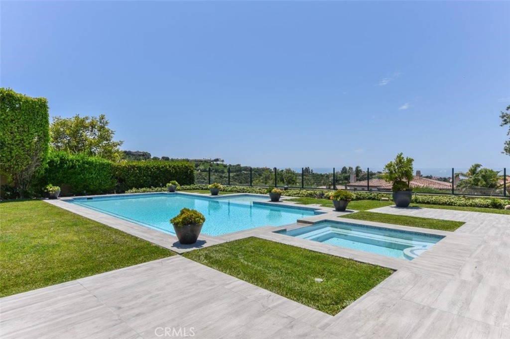 7 Via Brezza Newport Coast, CA 92657 - Photo 66 of 75 a view of swimming pool with seating area and trees around