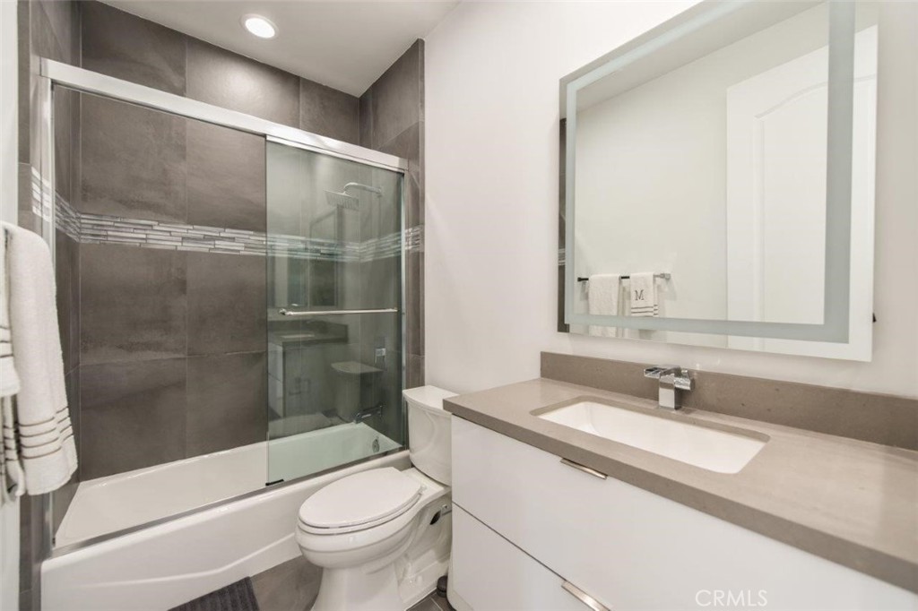 7 Via Brezza Newport Coast, CA 92657 - Photo 74 of 75 a bathroom with a sink a toilet and shower