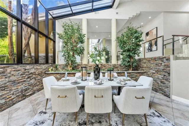 a view of a dining room with furniture window and outside view