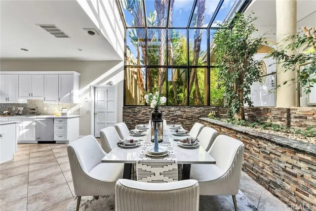 a kitchen with a sink cabinets and window