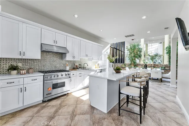a view of a dining room with furniture large window and wooden floor