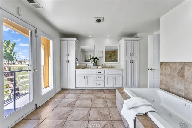 a spacious bathroom with a bathtub and toilet