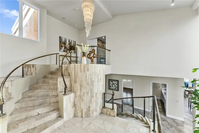 a view of a balcony dining table and chairs