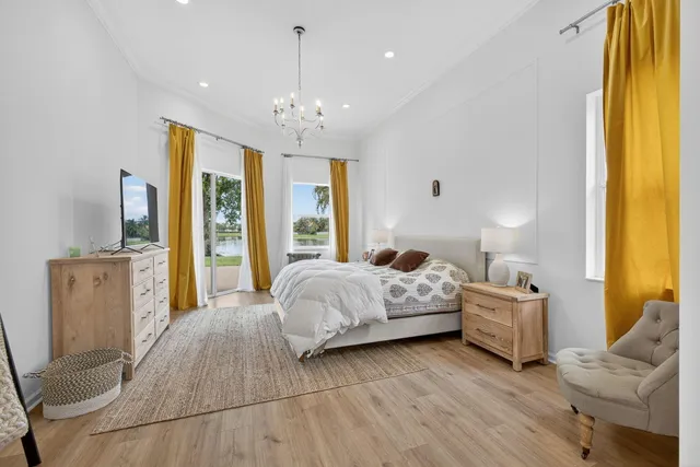 a large white bathroom with a granite countertop sink mirror and bathtub