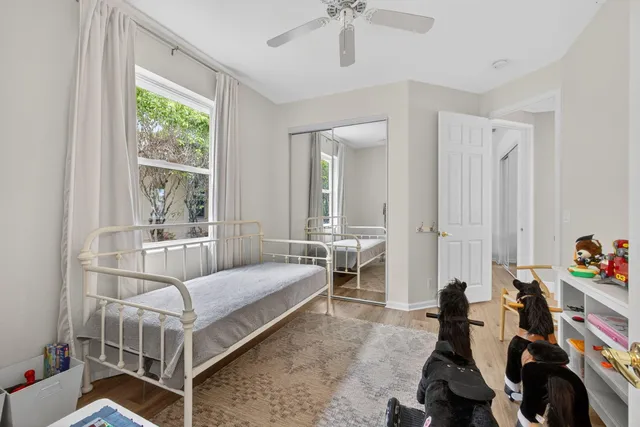 a front view of a house with a garden and yard