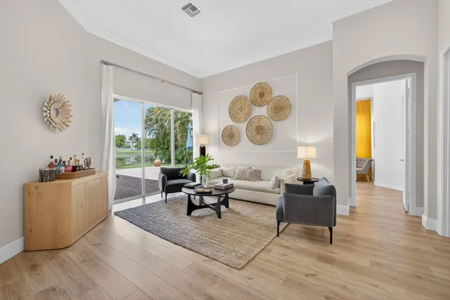 a living room with furniture and a large window