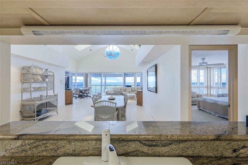 20 Seagate Drive, Unit 1102 Naples, FL 34103 - Photo 15 of 40 a living room with furniture