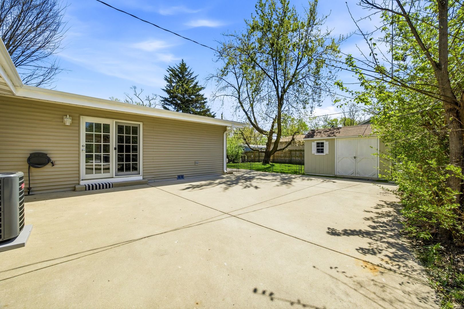 2117 Grouse Lane Rolling Meadows, IL 60008 - Photo 21 of 25 a front view of a house with a yard and garage
