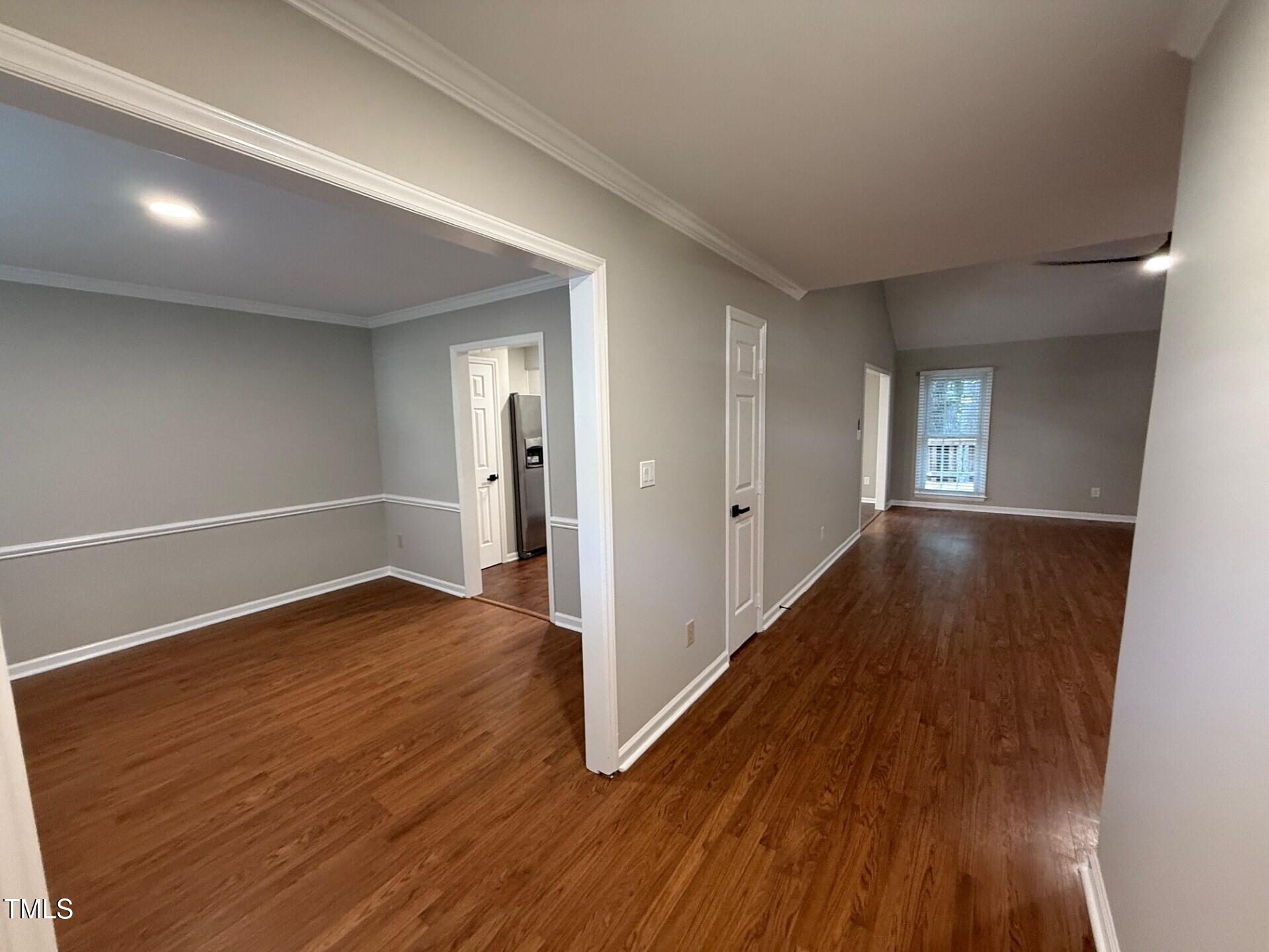 8316 Bellingham Circle Raleigh, NC 27615 - Photo 13 of 22 wooden floor in an empty room with a window