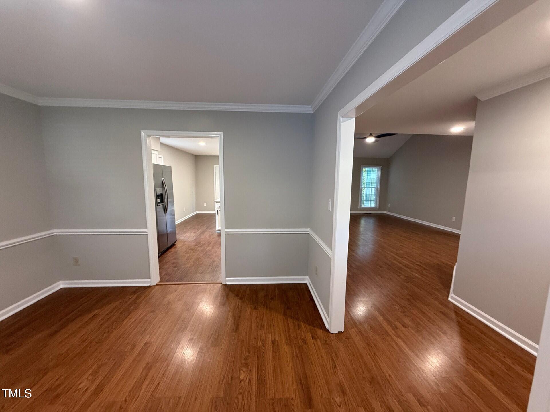 8316 Bellingham Circle Raleigh, NC 27615 - Photo 15 of 22 a view of a room with wooden floor and staircase