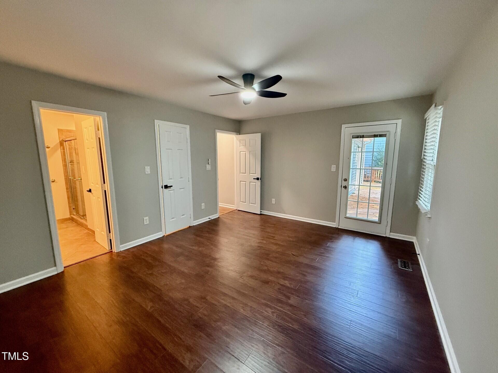 8316 Bellingham Circle Raleigh, NC 27615 - Photo 21 of 22 a view of an empty room with wooden floor and a window