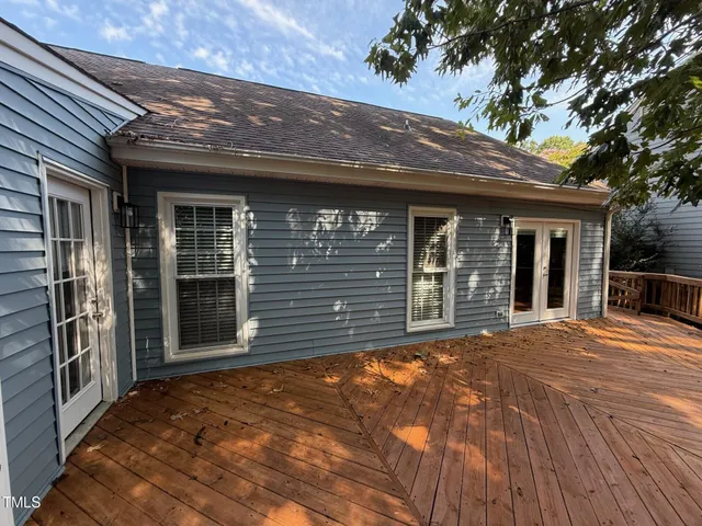 a front view of a house with large windows