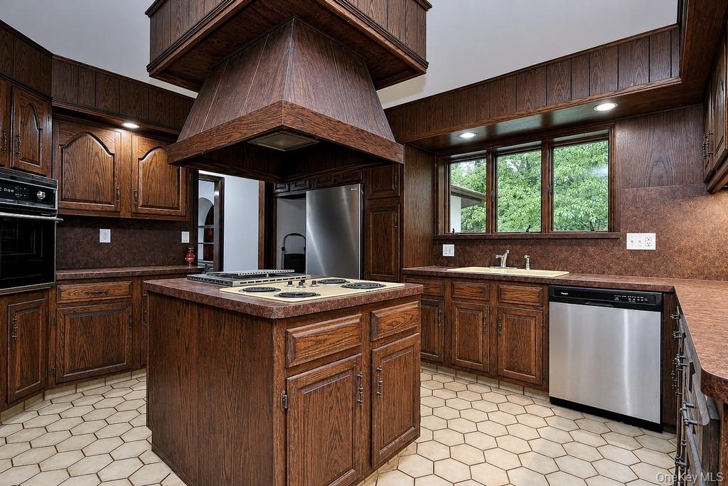 18 Hillside View Road Mahopac, NY 10541 - Photo 27 of 42 a kitchen with a stove sink and cabinets