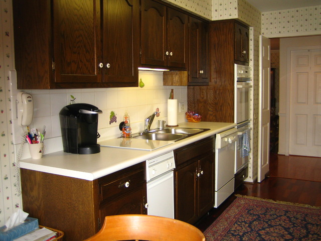 1140 Old Mill Road, Unit 504F Hinsdale, IL 60521 - Photo 12 of 21 a kitchen with a sink and cabinets