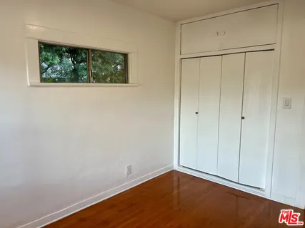 a view of house with backyard and porch