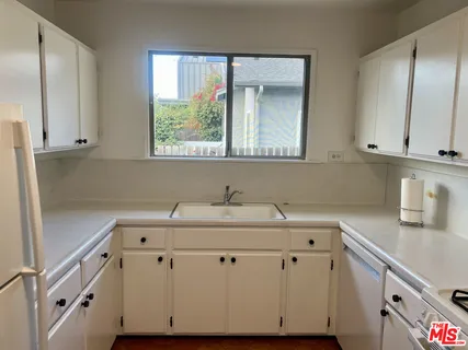 a view of cabinets with wooden floor