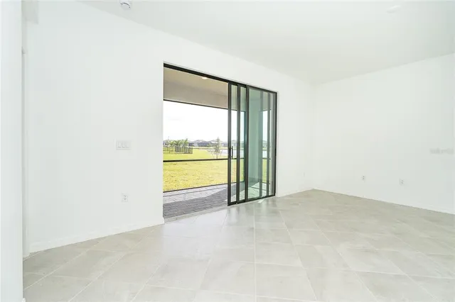 an empty room with an outdoor view and a window