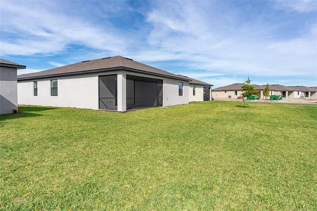 a big house with a big yard and large trees