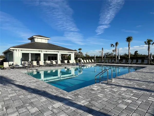 a view of house with outdoor seating