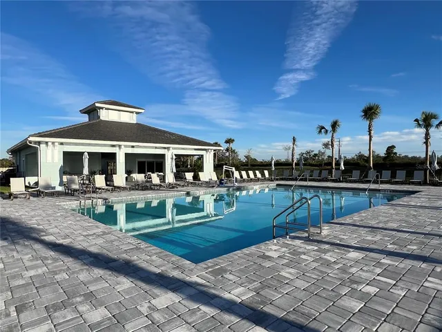 a view of house with outdoor seating