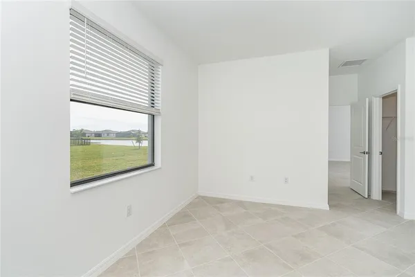 a bathroom with a shower and a mirror