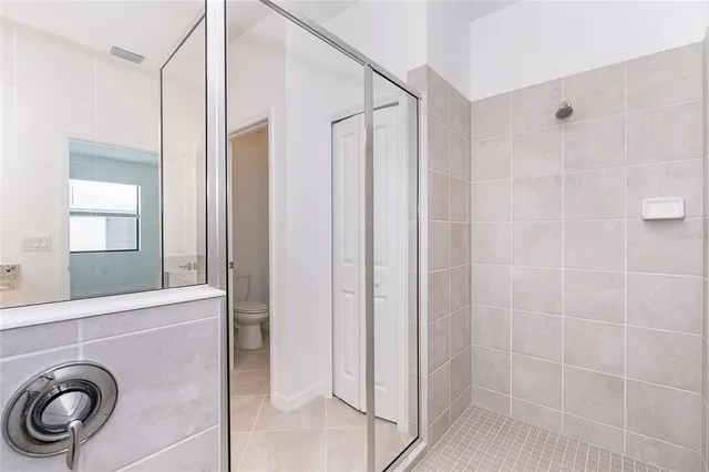 a bathroom with a granite countertop sink a toilet and bathtub