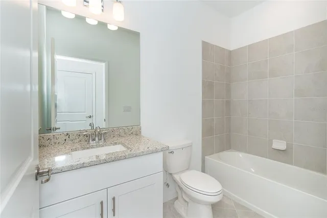 a view of a swimming pool with a table and chairs