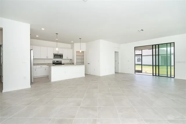 a view of a kitchen with a sink and a stove top oven