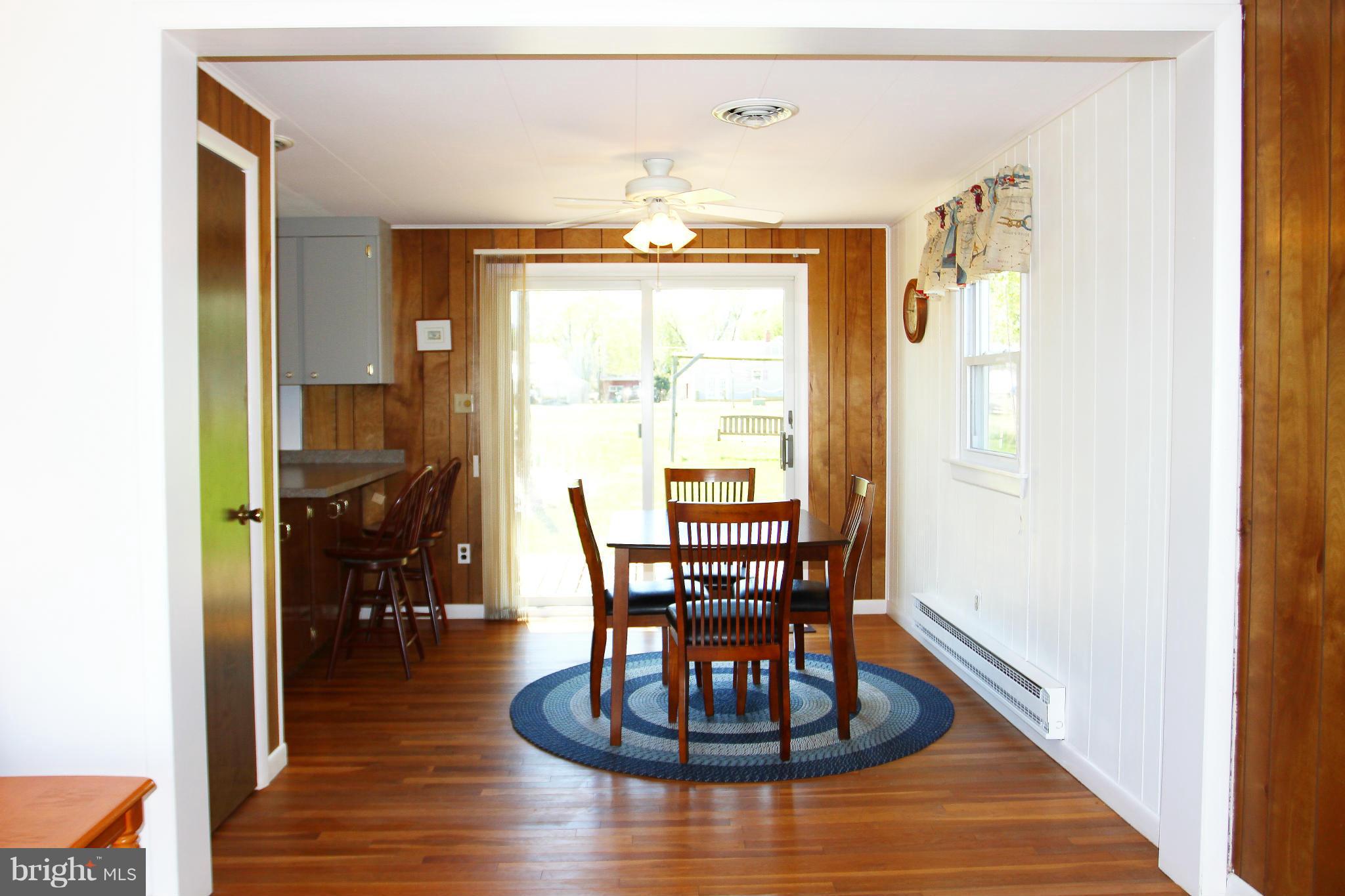 76 Basin Road Earleville, MD 21919 - Photo 9 of 22 Dining Room with sliders to back patio