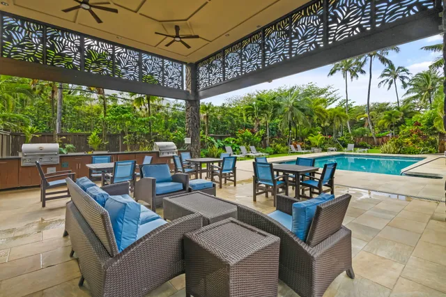 a view of a patio with couches table and chairs