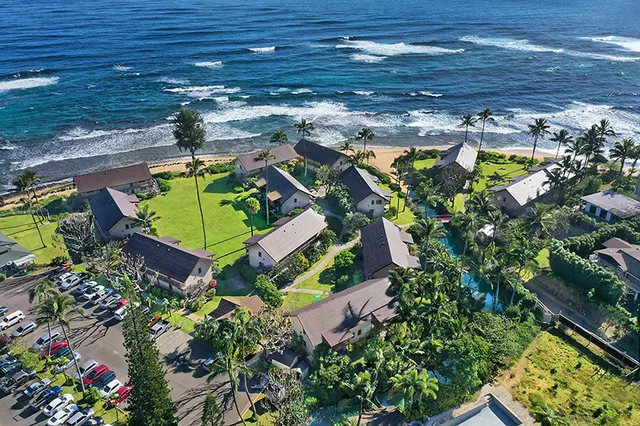 an aerial view of a house with a garden