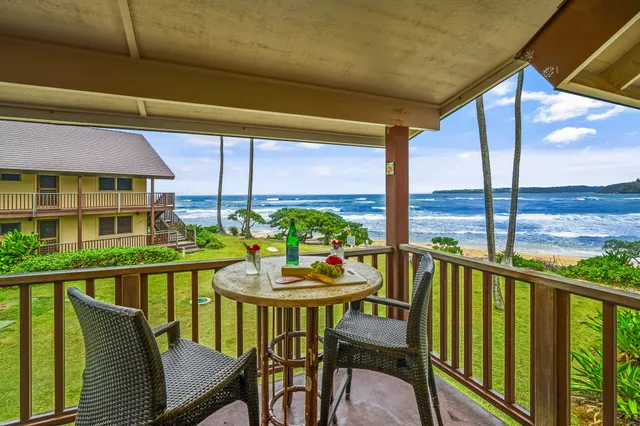 a view of an chairs and table in the balcony