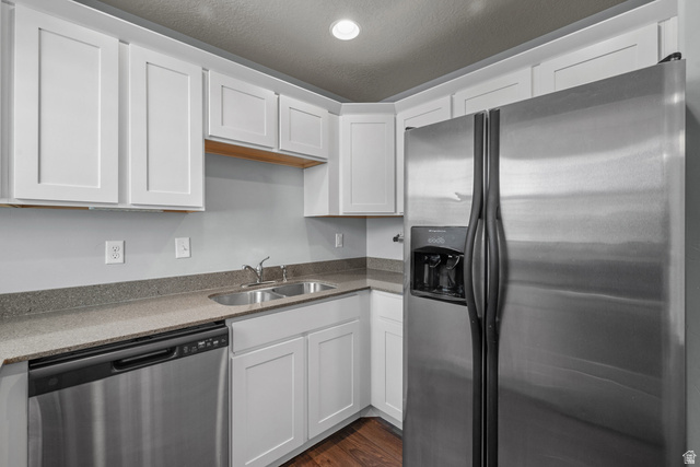 2457 West 500 South, Unit 2 Springville, UT 84663 - Photo 15 of 27 Modern kitchen featuring white shaker cabinetry, stainless steel appliances, a double basin sink, and wood-finish flooring