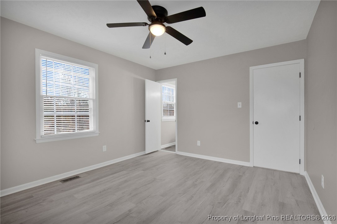 382 Saddle Ridge Road Fayetteville, NC 28311 - Photo 5 of 22 wooden floor in an empty room with a window