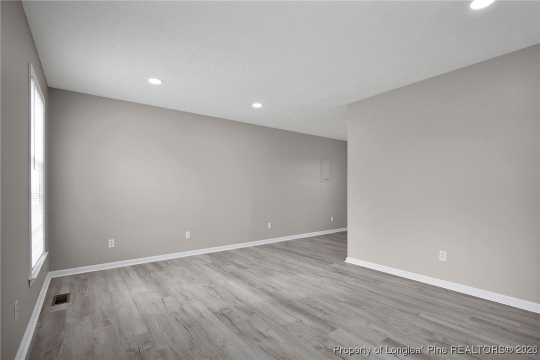 382 Saddle Ridge Road Fayetteville, NC 28311 - Photo 7 of 22 a view of an empty room with wooden floor