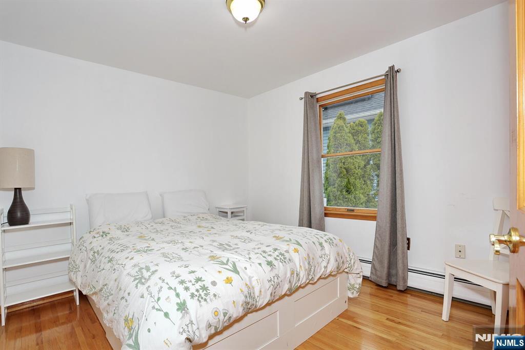 140 Prospect Street Hasbrouck Heights, NJ 07604 - Photo 21 of 28 a bedroom with a bed and a window