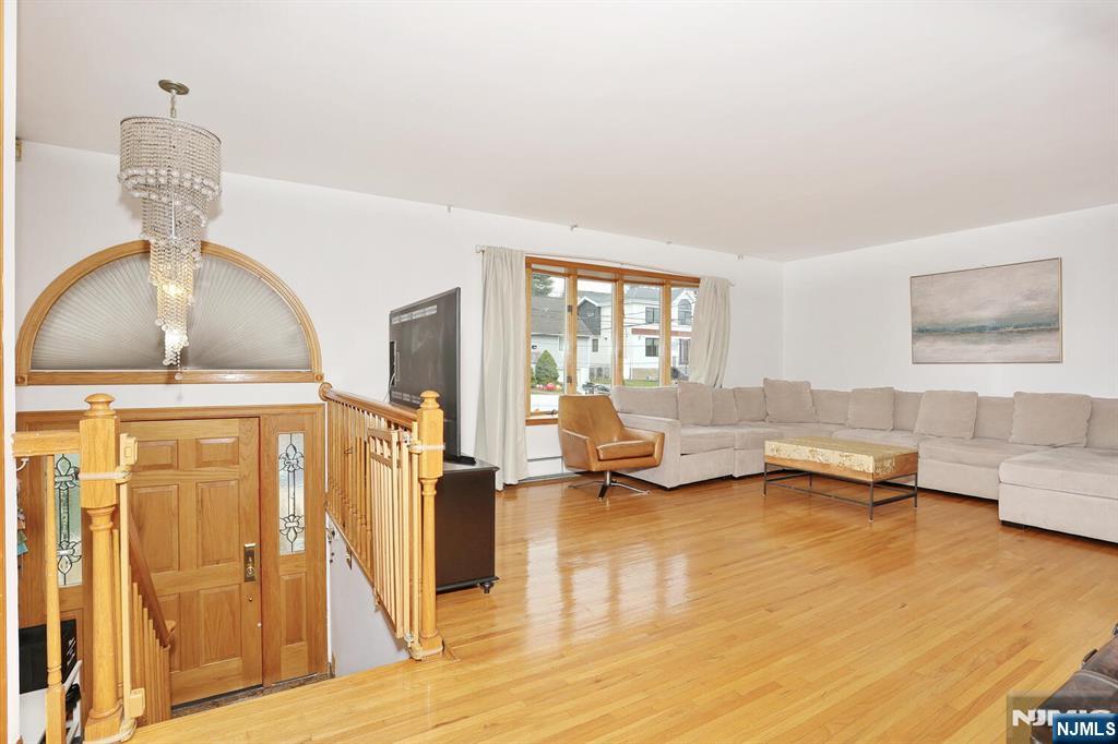 140 Prospect Street Hasbrouck Heights, NJ 07604 - Photo 4 of 28 a living room with furniture and a wooden floor