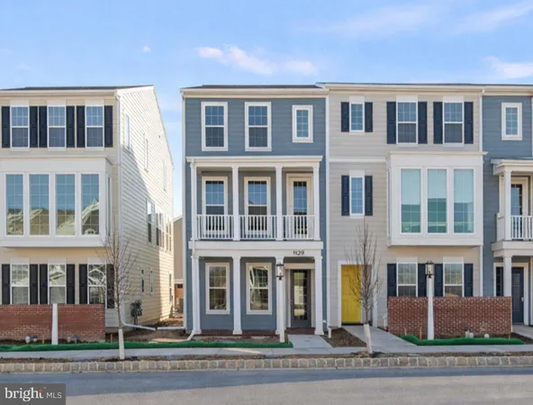 a front view of a building with a yard