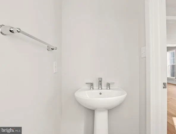 a bathroom with a sink a mirror and shower