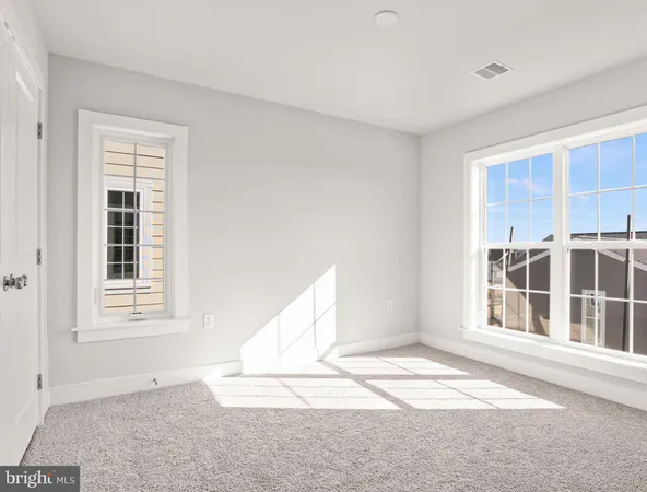 a view of empty room with windows