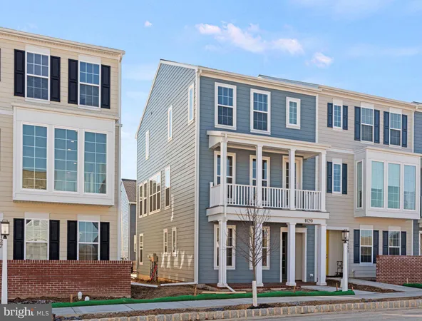 a front view of a building with a yard