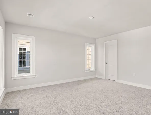 a view of empty room with windows