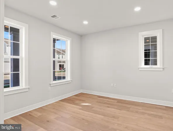 a view of empty room with windows