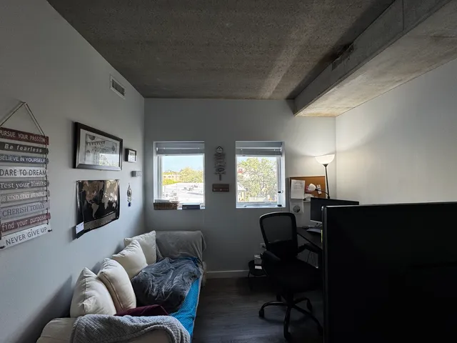 a bathroom with a sink vanity mirror and toilet