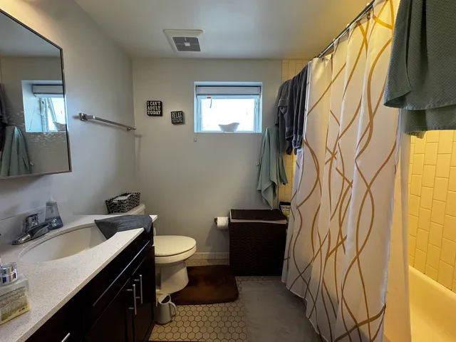 a bathroom with a toilet and a sink
